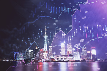 Obraz premium Financial graph on night city scape with tall buildings background multi exposure. Analysis concept.