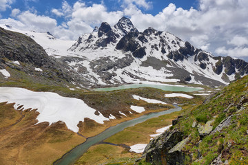 Fototapeta na wymiar Amazing turquoise Lake on the way to Rutor Glacier, Aosta Valley, Italy