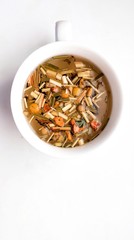 chamomile tea isolated background herbs in a cup