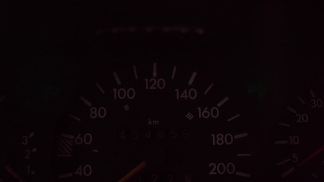 turn signal control light in car dashboard. an alarm signal on instrument panel at night.