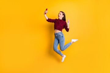 Fototapeta na wymiar Full size photo of cheerful lady with long haircut grimacing closing eyes wearing burgundy sweater isolated over yellow background