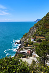 View of part of Riomaggiore village and sea. One of five famous centuries-old colorful villages of Cinque Terre National Park in Liguria, region of Italy.