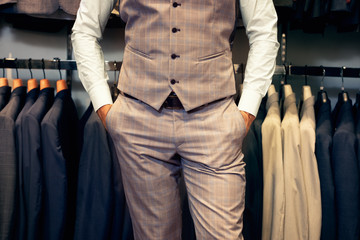 Midsection of man in suit
