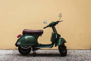 Fotobehang Vintage Vespa scooter parked on old street in Lisbon, Portugal © Tomas