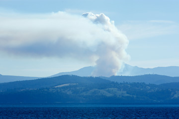 Hobart bush fire with smoke arising as seen from Bruny Island, Tasmania, Australia