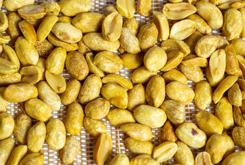 beautiful background from nuts on a beige  striped background