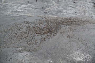 Sewage covered with thick brown foamed slurries (in sewage treatment plant) - texture