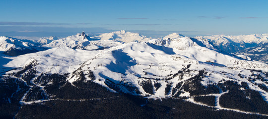 Whistler Mountain Ski Resort in British Columbia , Canada in the winter season with all the snow and mountains in the background