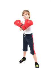 Sporty strong child boxing in red gloves and white t-shirt