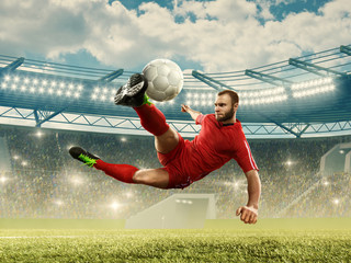 Soccer player in action on a stadium. Soccer championship. Stadium with fans