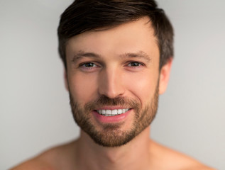 Obraz premium Mature Man Smiling At Camera Posing Over White Background