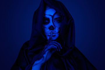 Mysterious zombie making silence gesture