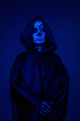 Bony lady in hooded cape