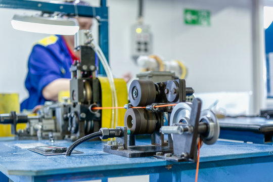 Wire stripping machine. Equipment for cutting wire into size.