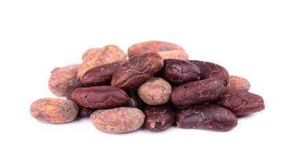 Unpeeled and peeled cacao beans, isolated on white background. Roasted and aromatic cocoa beans,...