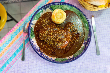 mole poblano with sesame seeds and rice soup,