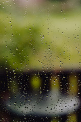 Rain drops on window. Autumn, fall illustration. Rainy weather. Looks like film filter.