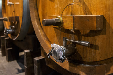 Series of barrels preserved in an Italian cellar for wine fermentation.