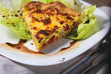 Vegetable Colorful Pie. Homemade quiche with chicken, goat cheese and spinach. Selective focus, vertical
