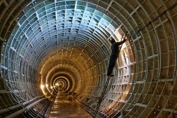 welder at underground subway construction site