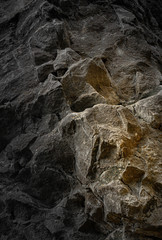 Steep rocky cliff with warm accent