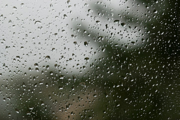 Natural water drops on glass