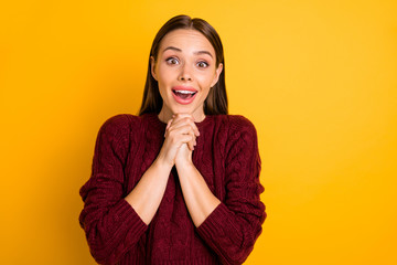 Photo of excited attractive cute nice girl saying wow in order to express her admiration while isolated with yellow background