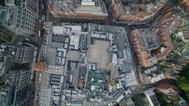 Top down aerial establishing shot of Knightsbridge, Harrods roof