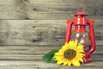 Thanksgiving background with vintage kerosene lamp and sunflower