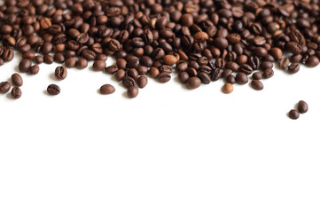 Graceful scattering of coffee on a white background with a place for copy-paste.