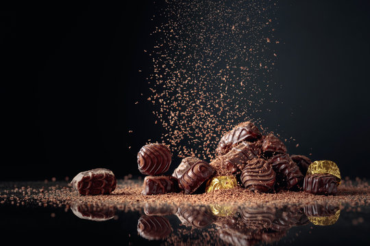 Chocolate candies sprinkled with chocolate chips.