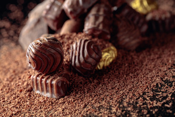 Chocolate candies sprinkled with chocolate chips.