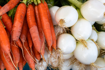 Onions and carrots close-up. Beautiful vegetable background.