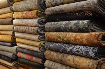 A fragment of multicolor knitted woolen carpets, useful as a backdrop for your design work.