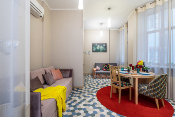 Modern interior of light studio apartment. Living room.