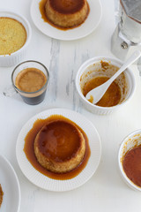 Caramel flan, crema catalana dessert on white woden table