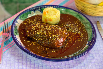 mole poblano with sesame seeds and rice soup,