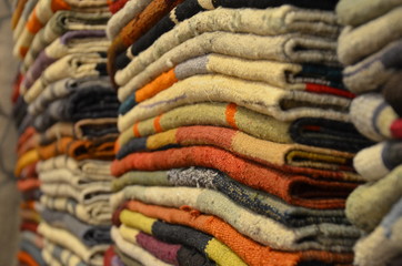 A fragment of multicolor knitted woolen carpets, useful as a backdrop for your design work.