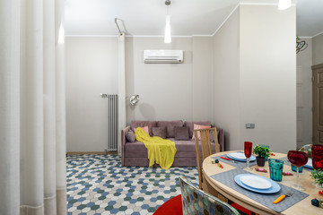 Modern interior of light studio apartment. Living room.