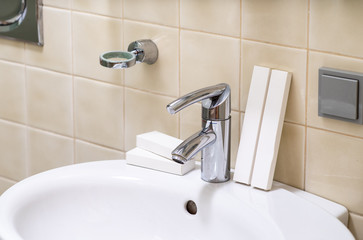 Modern interior of bathroom. White sink. Close-up.