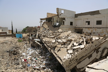 A school destroyed by Arab coalition missiles after Al-Houthi militia turned it into a military...