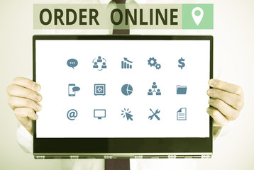 Word writing text Order Online. Business photo showcasing activity of buying products or services over the Internet Male human holding thick textured cardboard of business promotion concept