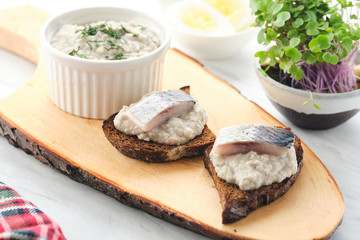 Forshmak - traditional Jewish cuisine. Sandwich with minced herring fillets with apple, onion and egg.