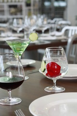 glasses of green martini on table in restaurant