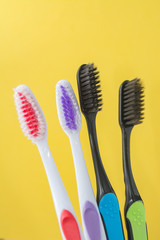 toothbrushes are multicolored on a bright colored background close-up