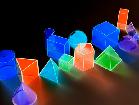 Colorful luminescent geometric shapes on black background
