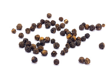 black pepper grains isolated on white background
