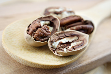 pecan close-up macro high resolution on wooden background