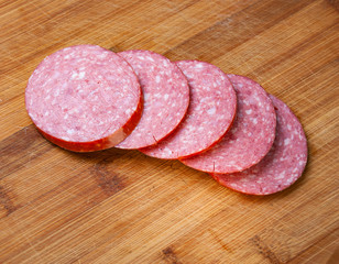 Sausage cut into slices on a cutting Board