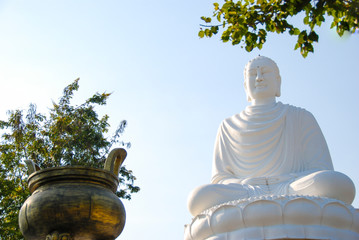 White statue of sitting Buddha in Long Son Pagoda, Nha Trang, Vietnam 